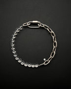 A handmade silver industrial chain necklace with large, rectangular links.
The necklace is made of stainless steel. The necklace is made half-half from thick 4mm chain and 12mm clear glass beads.The necklace includes a quick link carabiner and a smiley pendant.