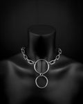 A handmade silver industrial chain ring necklace with large, rectangular links. The necklace is made of stainless steel. The necklace is made from thick 4mm chain and two rings. The necklace includes a quick link carabiner and a smiley pendant.