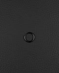 A single, stainless steel circular hoop earring in black finish. The earring features a thin, continuous metal band with a small hinged closure mechanism visible on one side, creating a simple and uniform ring shape for ear piercing.
