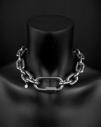 A handmade silver industrial chain necklace with thick, bold, large, chunky, rectangular links with a brass padlock and two keys. The necklace is made of stainless steel. The necklace is made from thick 6mm chain. The necklace includes a quick link carabiner and a smiley pendant.