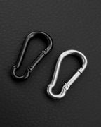 A silver stainless steel carabiner in black and silver