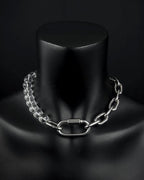 A handmade silver industrial chain necklace with large, chunky, rectangular links. The necklace is made of stainless steel. The necklace is made half-half from thick 4mm chain and 12mm glass transparent beads. The necklace includes a quick link carabiner and a smiley pendant.