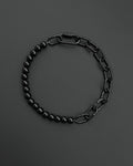 A handmade black industrial chain necklace with large, rectangular links.
The necklace is made of stainless steel. The necklace is made half-half from thick 4mm chain and 12mm glass black beads.The necklace includes a quick link carabiner and a smiley pendant.
